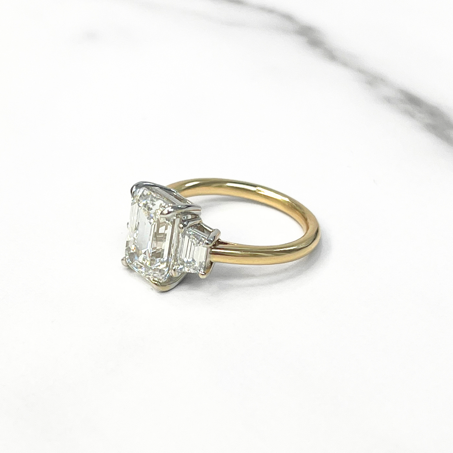 Emerald Cut Diamond Trapezoid Three Stone Ring