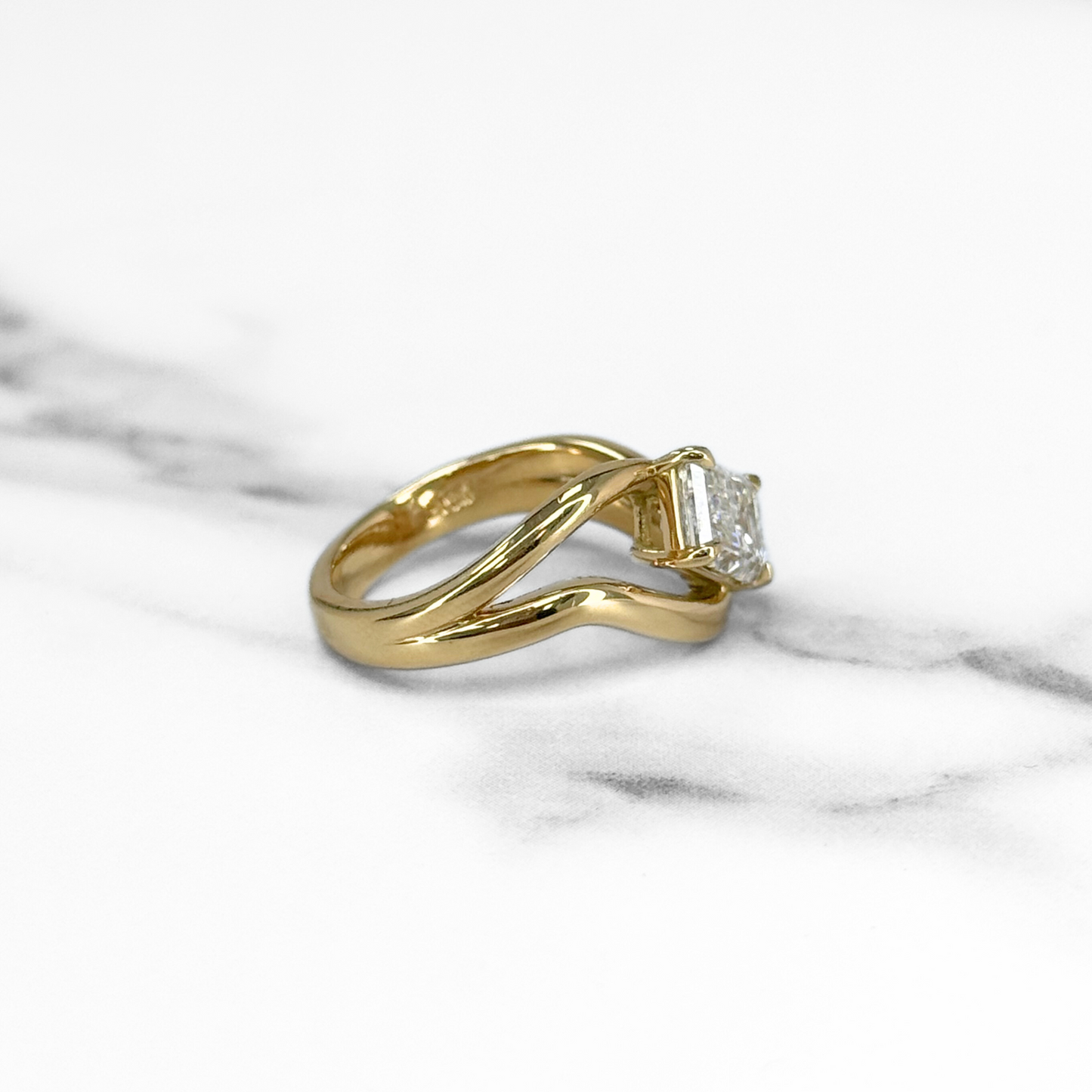 Curved Emerald Cut Diamond Solitaire Ring