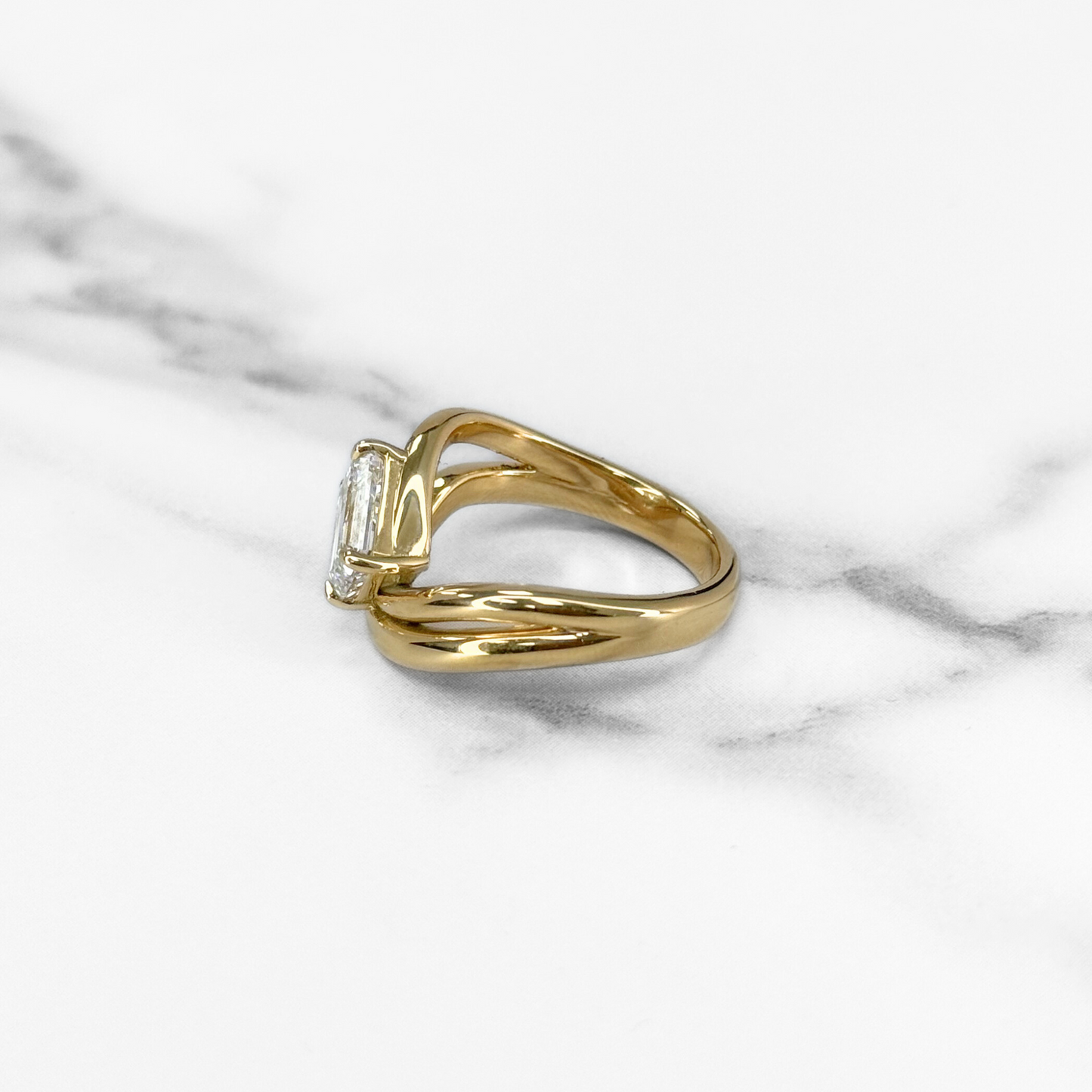 Curved Emerald Cut Diamond Solitaire Ring