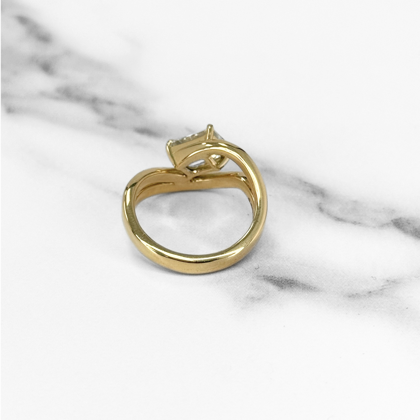 Curved Emerald Cut Diamond Solitaire Ring