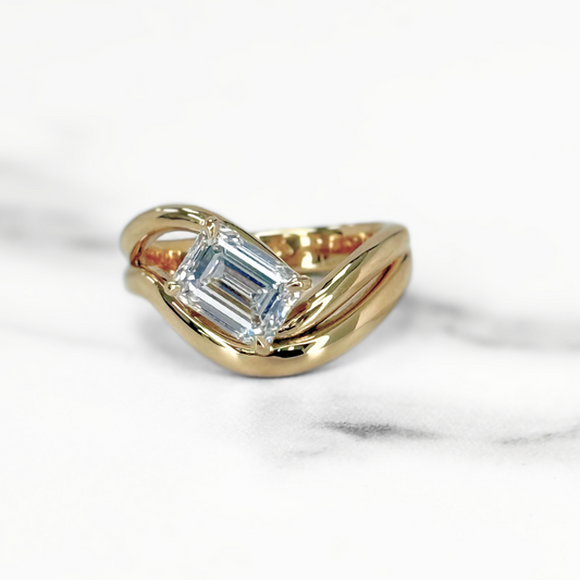 Curved Emerald Cut Diamond Solitaire Ring