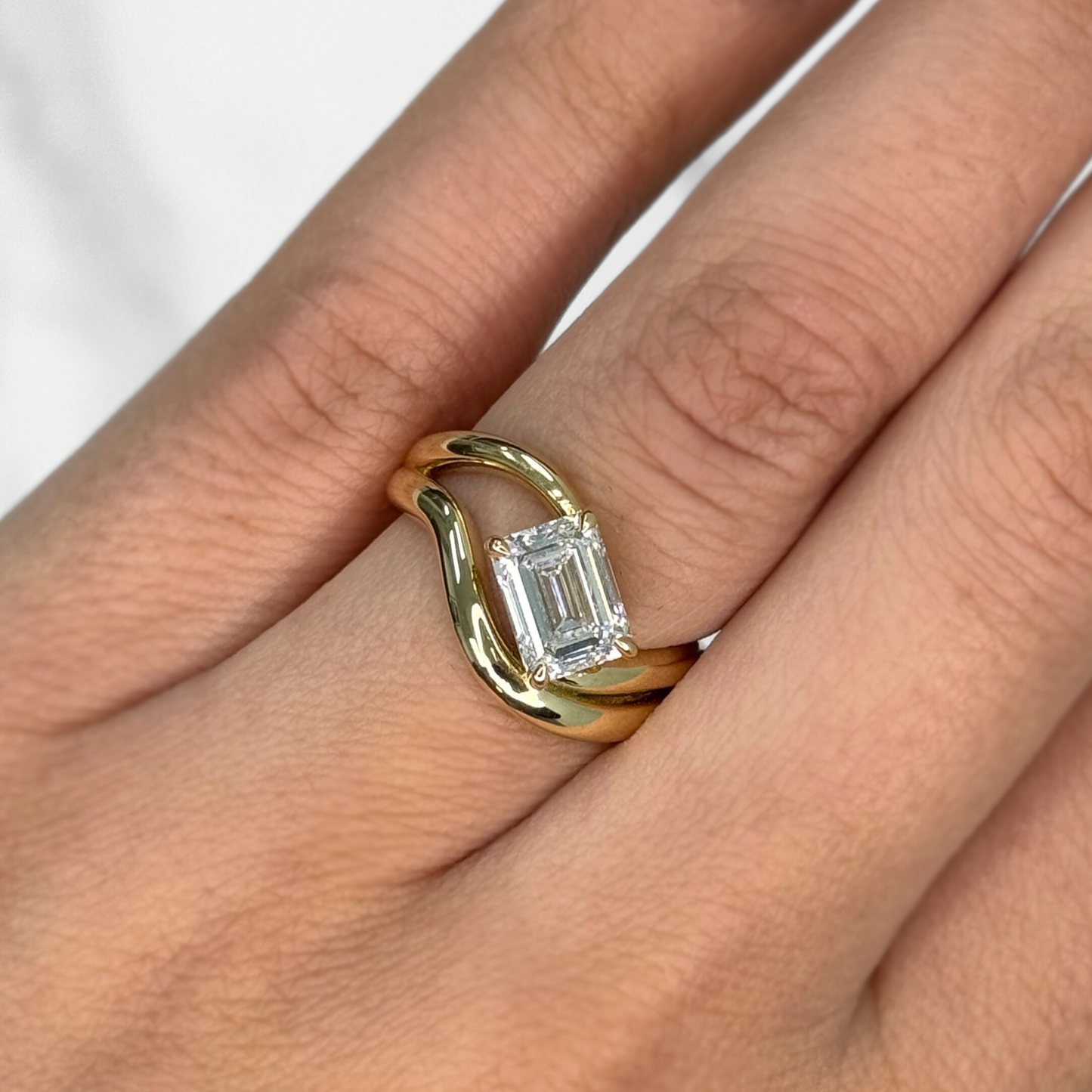 Curved Emerald Cut Diamond Solitaire Ring