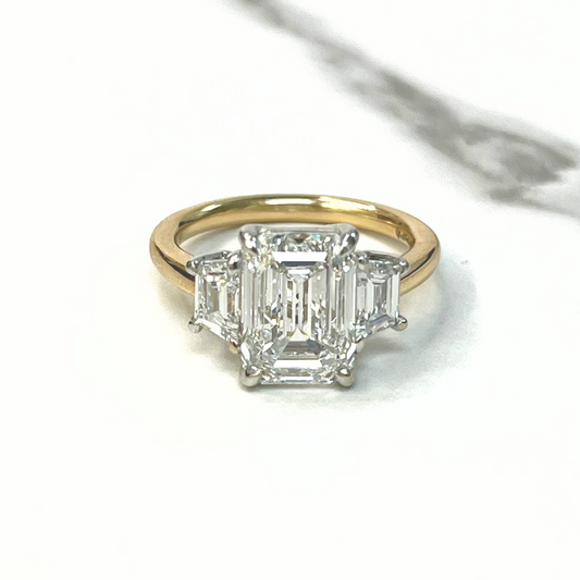 Emerald Cut Diamond Trapezoid Three Stone Ring