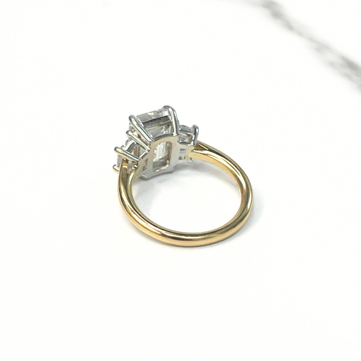 Emerald Cut Diamond Trapezoid Three Stone Ring